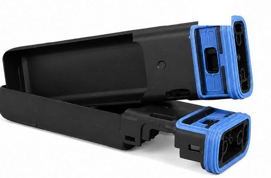 Silicone overmolded onto a connector with metal contacts